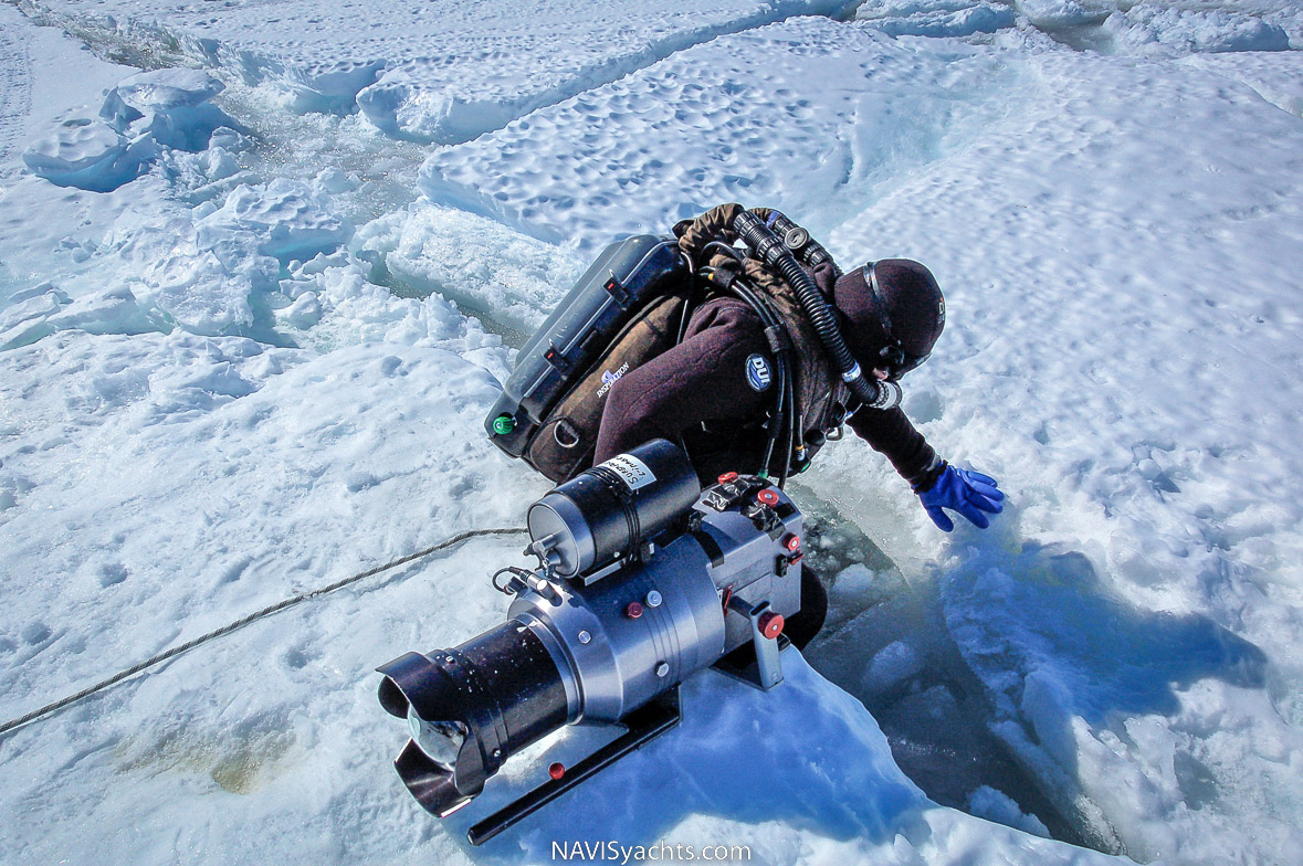 Didier Noirot diving through the cracks of the ice