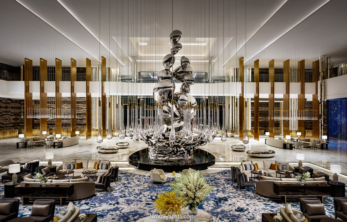 Lobby at Atlantis The Royal Dubai featuring fire and water installation and Droplets sculpture by Giles Miller