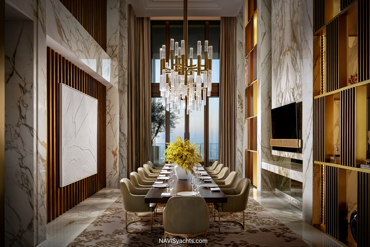 Luxury suite interior at Atlantis The Royal with floor-to-ceiling views of Palm Jumeirah and curated modern design