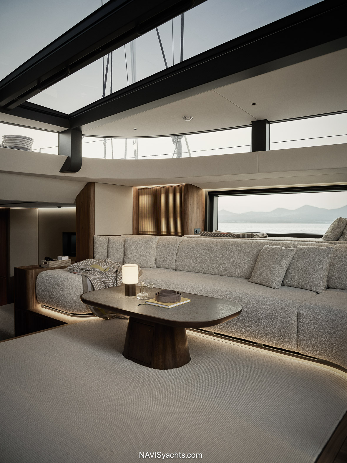 Minimalist interior of sailing yacht Zemi featuring walnut, limestone, and backlit rice paper by AML Arkitekter