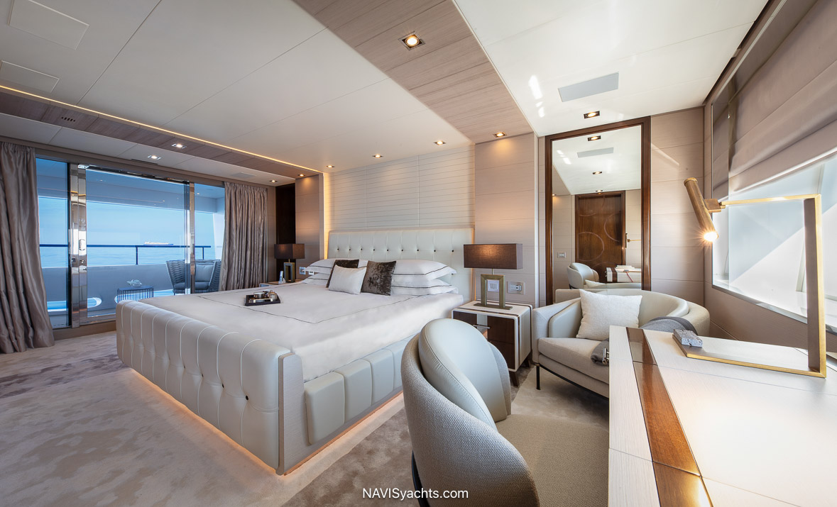Luxurious owner's cabin on Benetti 50m M/Y AJ, featuring modern oak decor, walnut accents, and a floating bed setup, epitomizing private opulence and tranquility.
