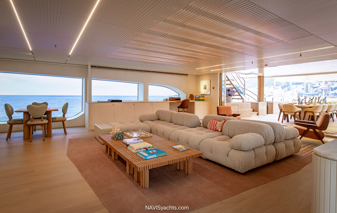 Benetti Superyacht Kasper. The creamy puffs of organically rounded sofa and chair shapes playfully entertain the pastel pink touches and translucent yellow coffee table across the 10-meter span.