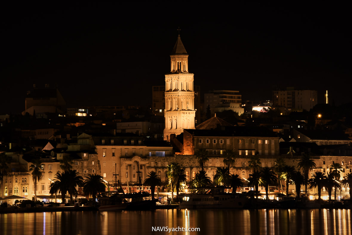 Historic Split old town, a blend of ancient architecture and vibrant street life, with M/Y Cristal docked nearby.