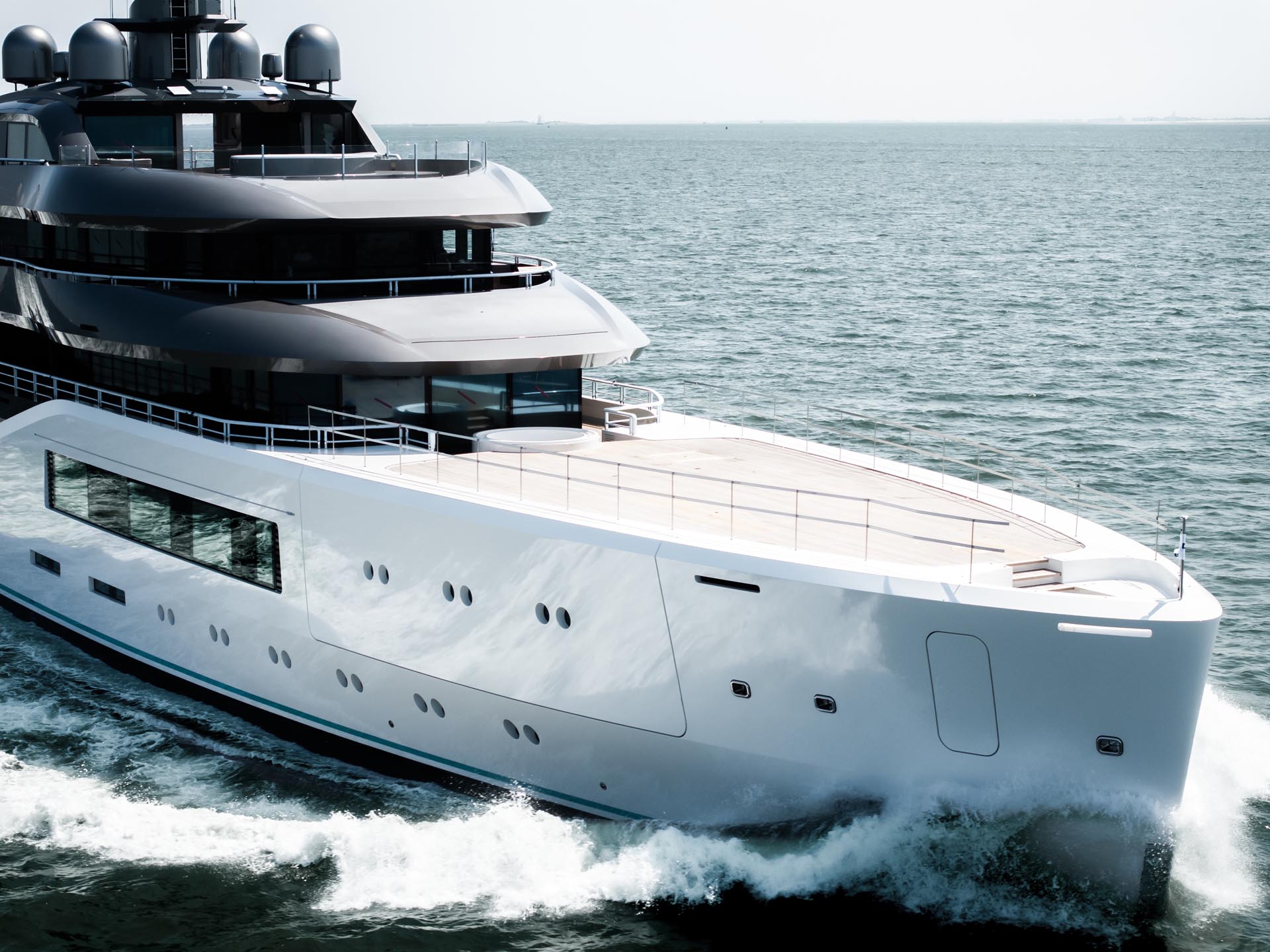  striking, full-length profile shot of Amels 80 'Pangea' underway during sea trials, highlighting Espen Øino’s exterior lines.