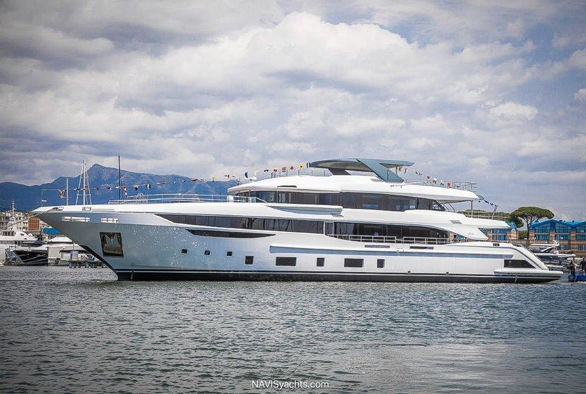 Elegant Heesen yachts, including Bookends and ELA, displayed at the Superyacht Village during FLIBS 2024.