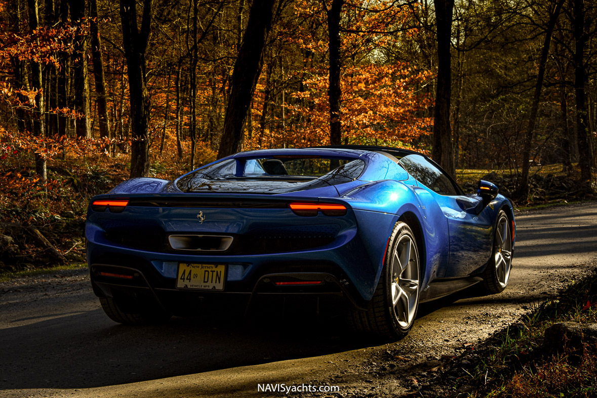 The sleek Ferrari 296 GTS cruising through the colorful autumnal landscapes of the East Coast.