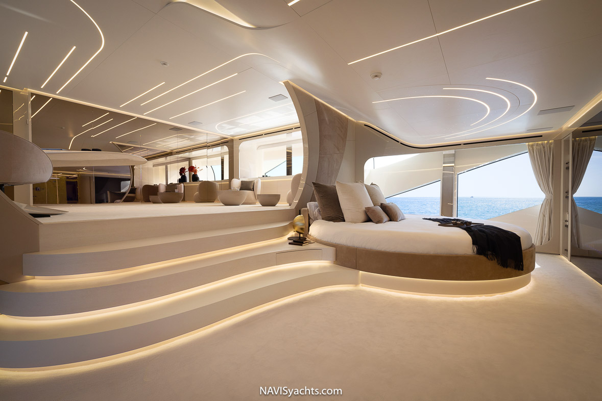 Spacious and serene master stateroom with a modern circular bed