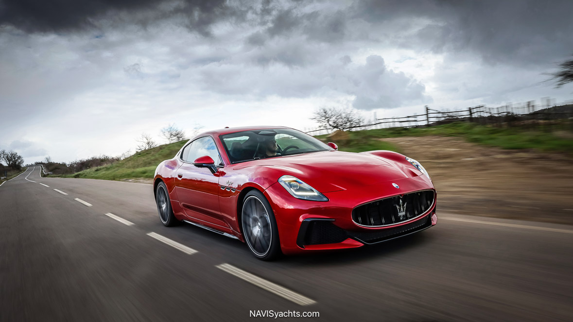 The Maserati GranTurismo Trofeo parked on a sunlit street in South Florida, showcasing its elegant design and powerful stance.
