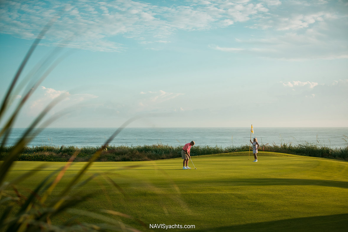 Lush fairways of a premier Palm Beach golf course near the marina, epitomizing Florida's reputation as the Golfing Capital.
