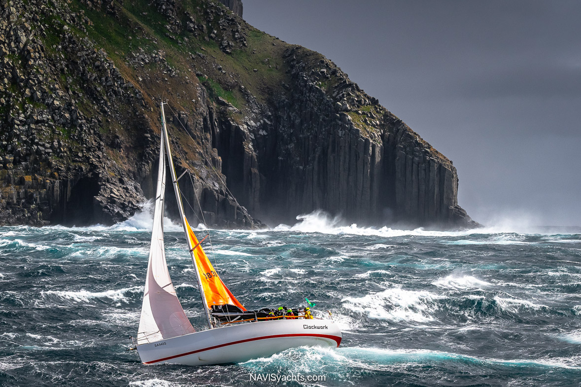 Dramatic Sail Damage Mid-Race – A yacht struggling with torn sails and equipment failure during the grueling offshore leg.