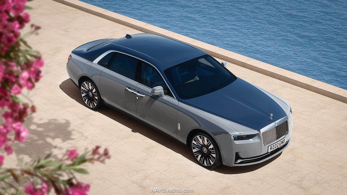 Rolls-Royce Ghost Series II in Mustique Blue front 3/4 view showcasing illuminated grille