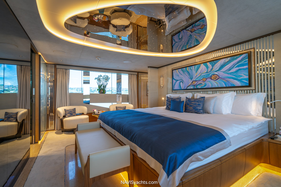 Owner’s suite on Eternal Spark with expansive windows and elegant decor