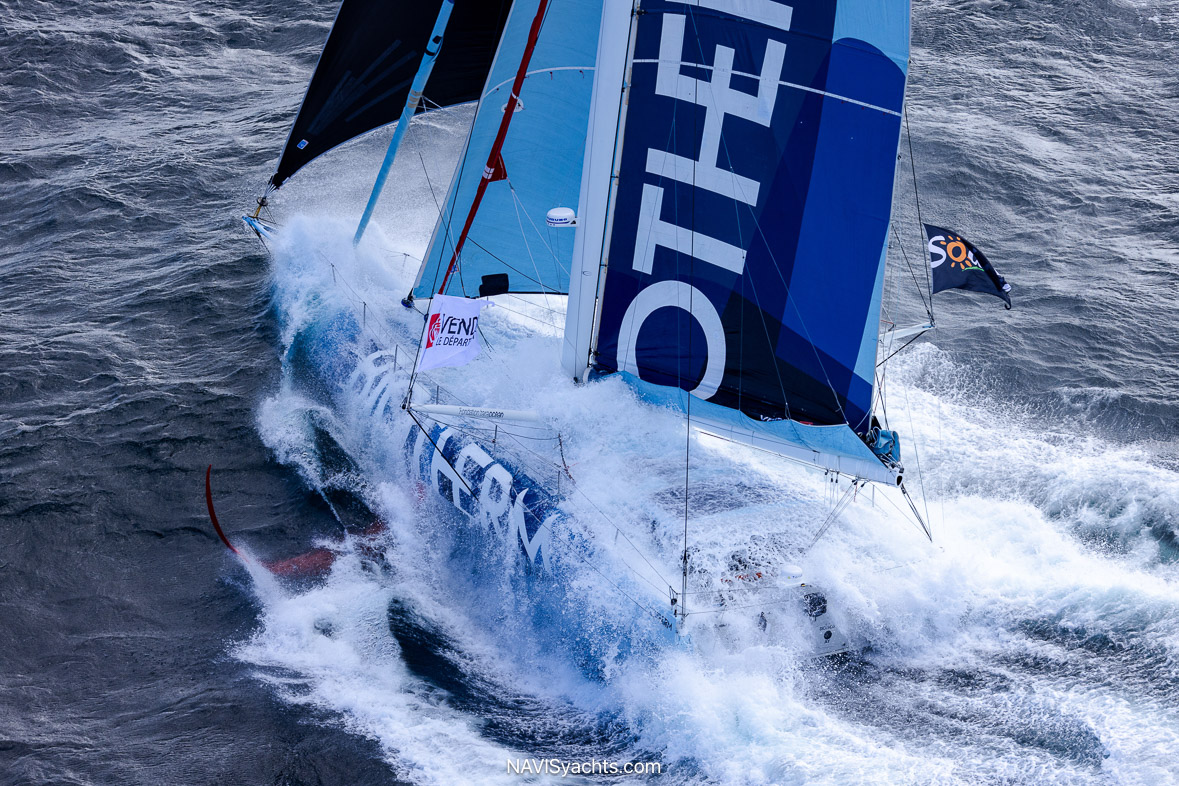 A dramatic scene in the Bay of Biscay, with a Vendée Globe yacht battling gale-force winds and turbulent, confused seas during the final, treacherous stretch of the race to Les Sables d’Olonne.
